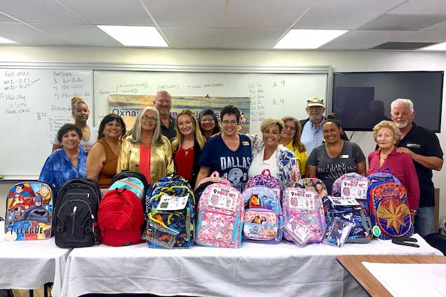 Group with backpacks for charity.